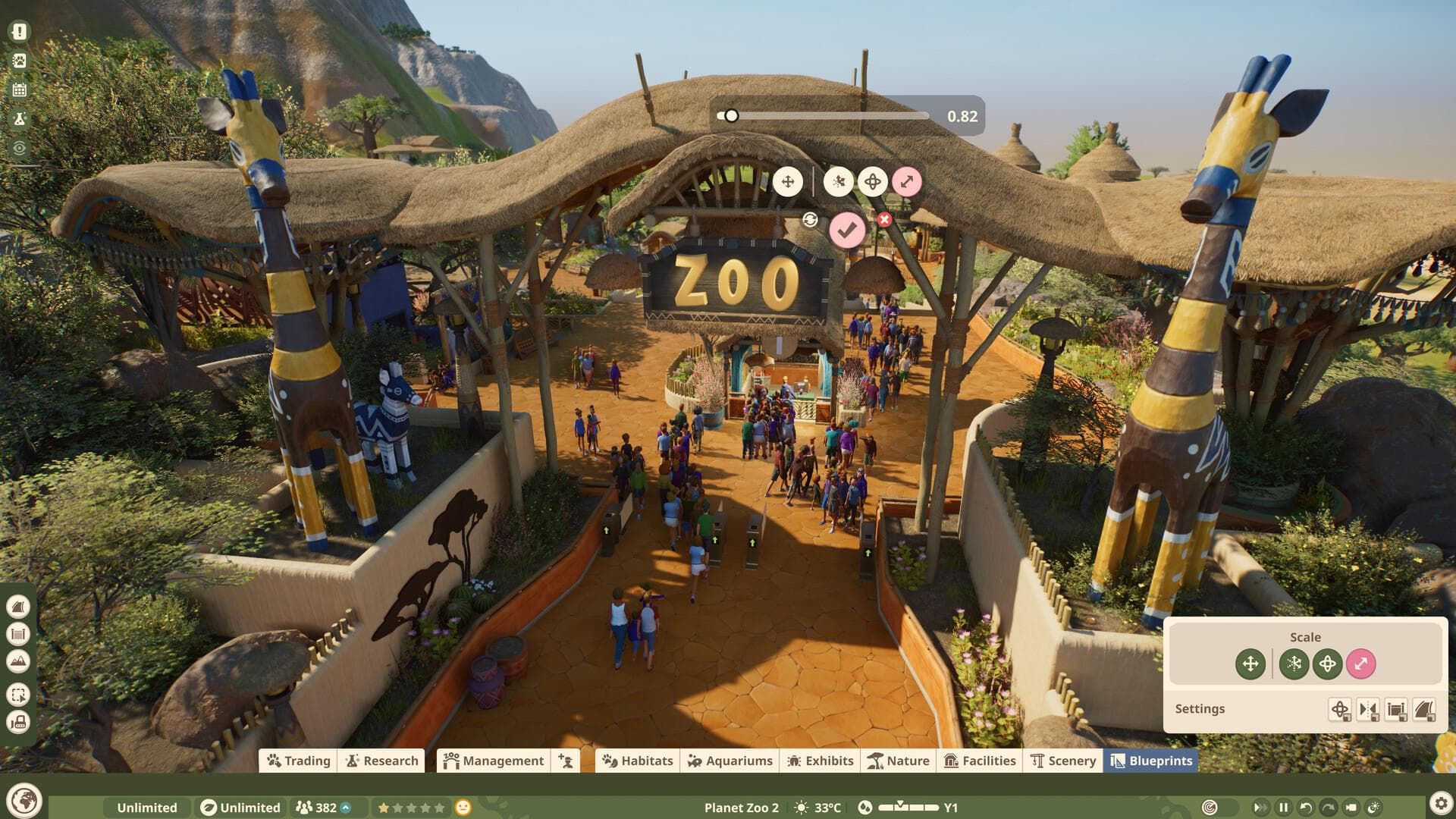 Planet Zoo 2 sur PC : entrée d’un zoo remplie de visiteurs